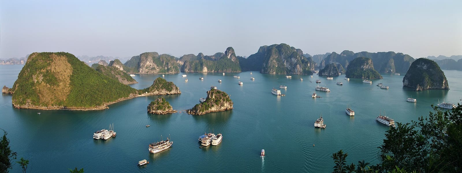 Boats anchored among the limestone islands of Ha Long Bay