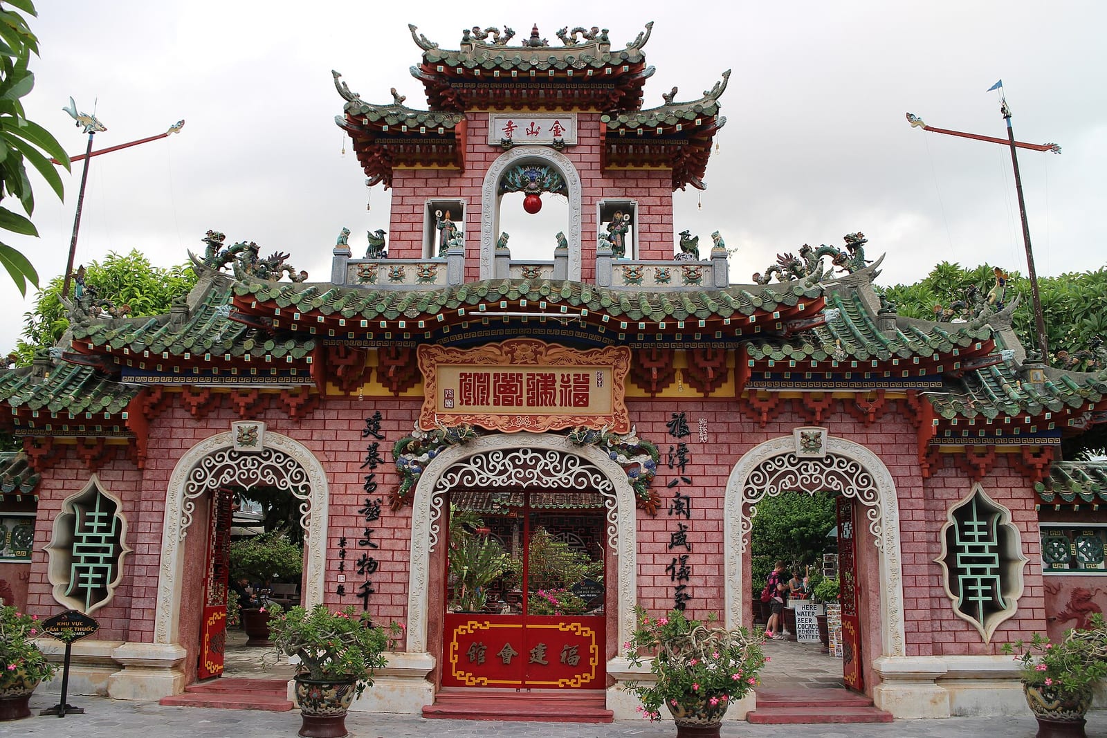 The red and green gate of the Fujian Assembly Hall in Hoi An