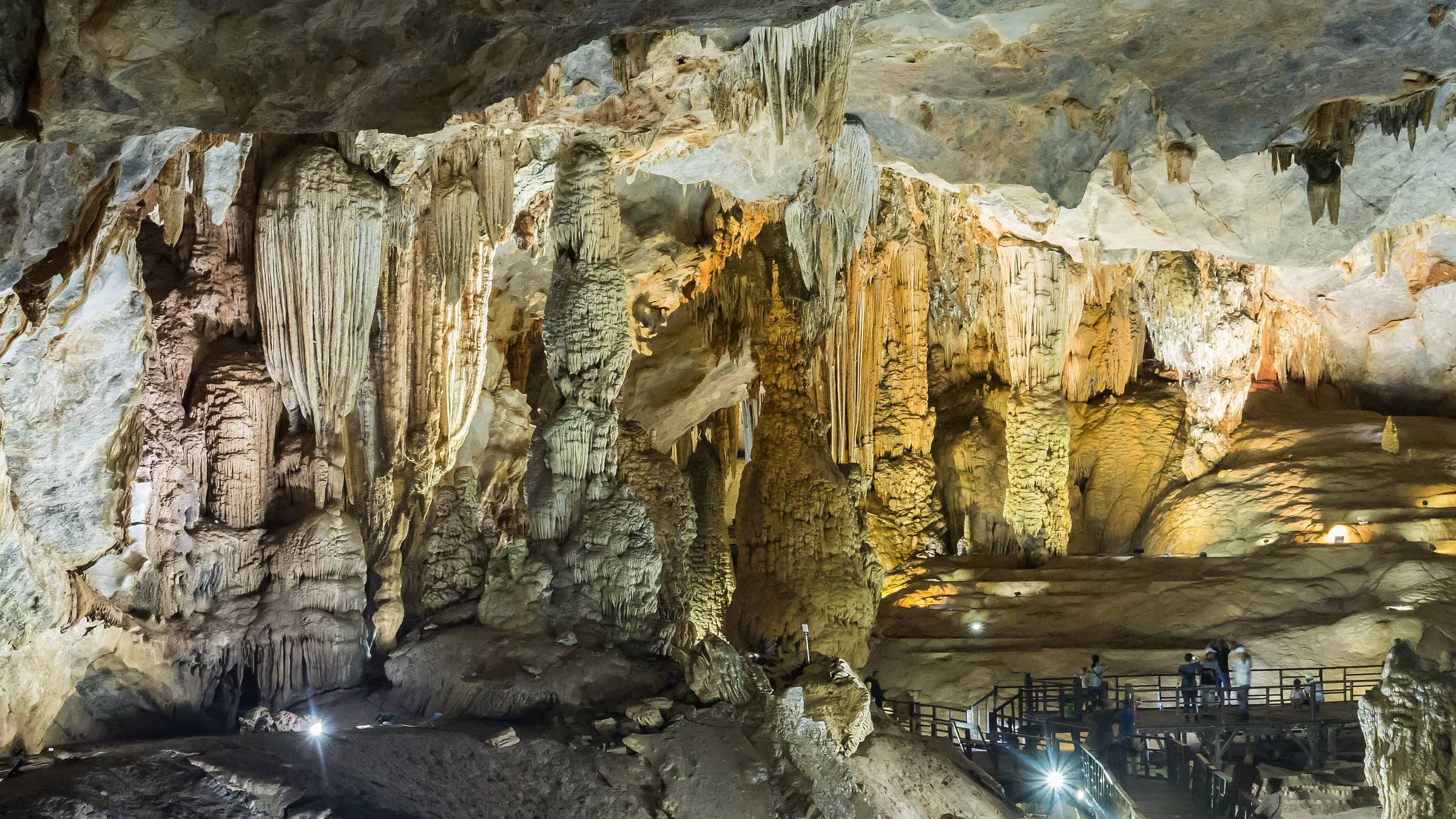 Golden stalactite and flowstone formations inside Paradise Cave in Phong Nha-Ke Bang