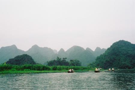Boats on the Tay river on the way to the Perfume Pagoda