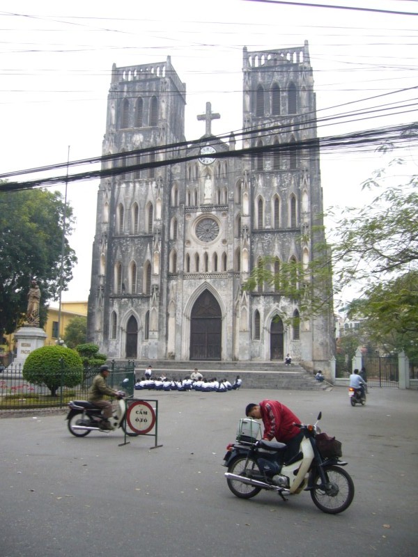 St Joseph's Cathedral in Hanoi seen from the street with a motorbike in front