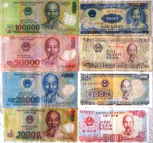 Vietnamese dong banknotes: 100,000, 50,000, 20,000 and 10,000 polymer notes beside older 5,000, 2,000, 1,000 and 500 notes